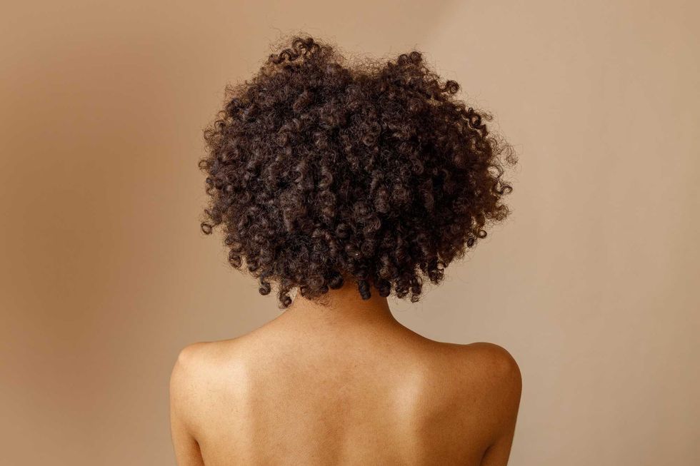 Silhouette of stylish model woman in studio - stock photo