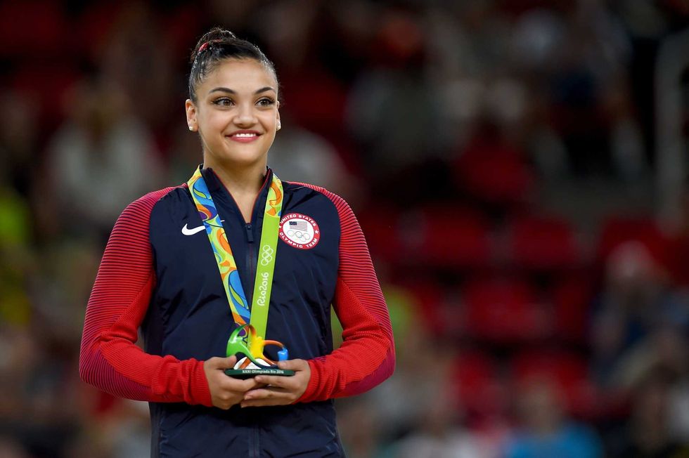 Silver medalist Laurie Hernandez celebrates on the podium at the medal ceremony