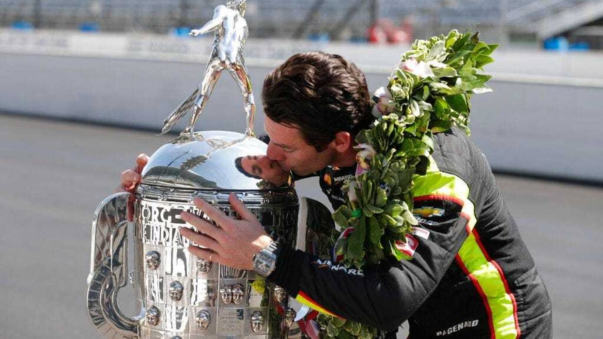 Simon Pagenaud, of France, winner of the 2019 Indianapolis 500 auto race, poses during the traditional winners photo session at the Indianapolis Motor Speedway in Indianapolis, Monday, May 27, 2019.