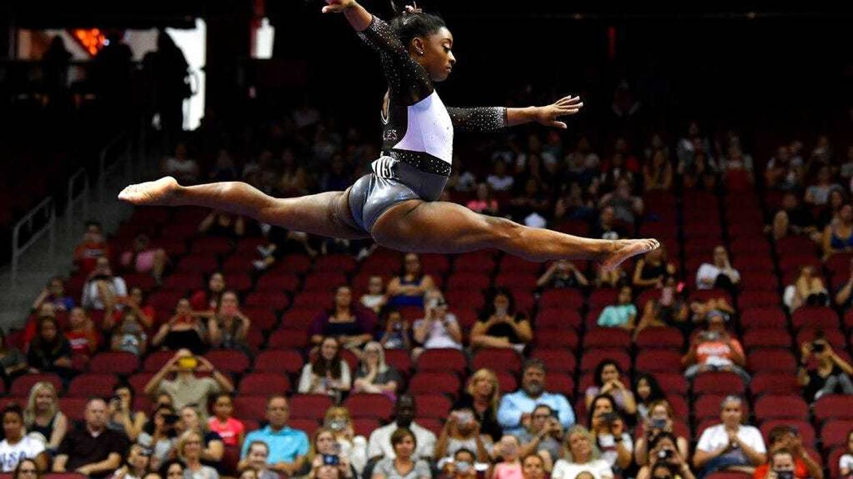 Simone Biles performs her balance beam routine during the GK US Classic gymnastics meet in Louisville, Ky., Saturday, July 20, 2019.