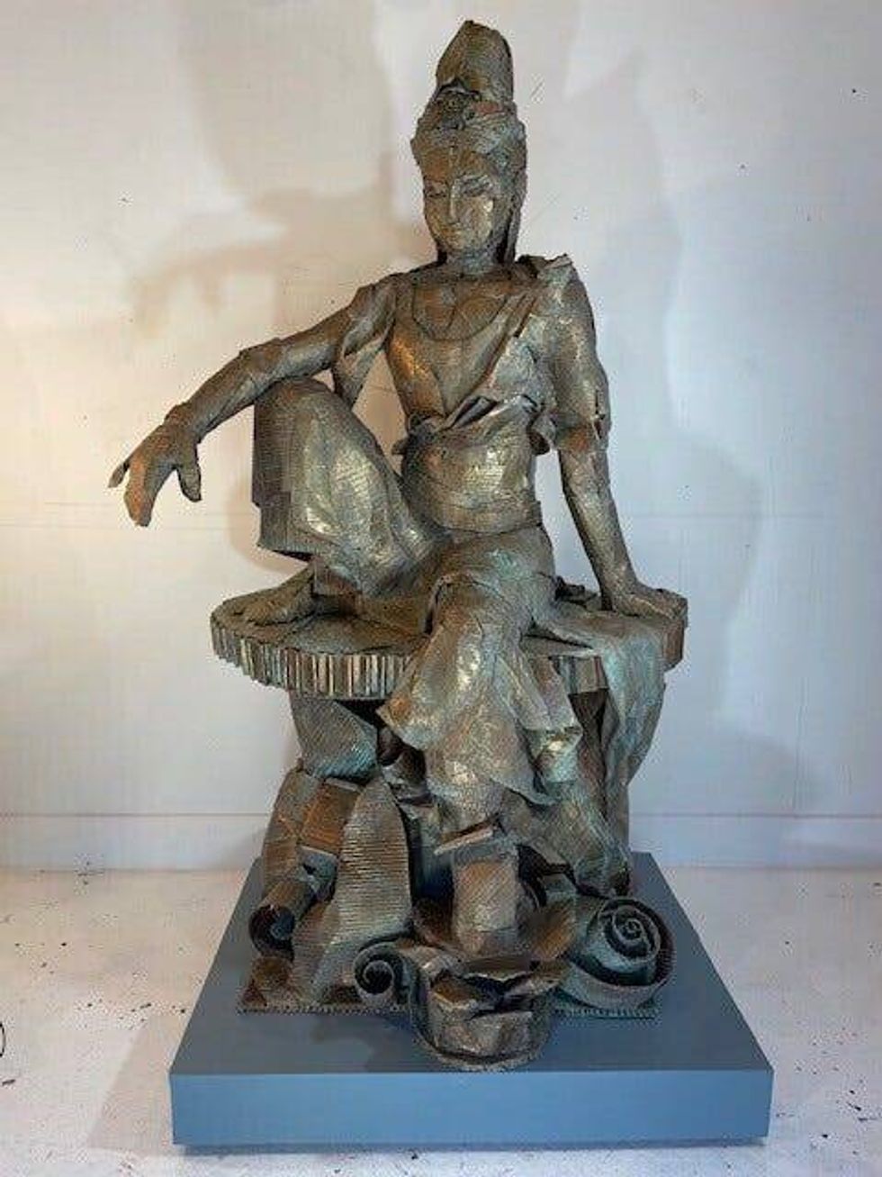 Simone Spicer made this statue of the Buddhist deity Kuan Yin from recycled cardboard.