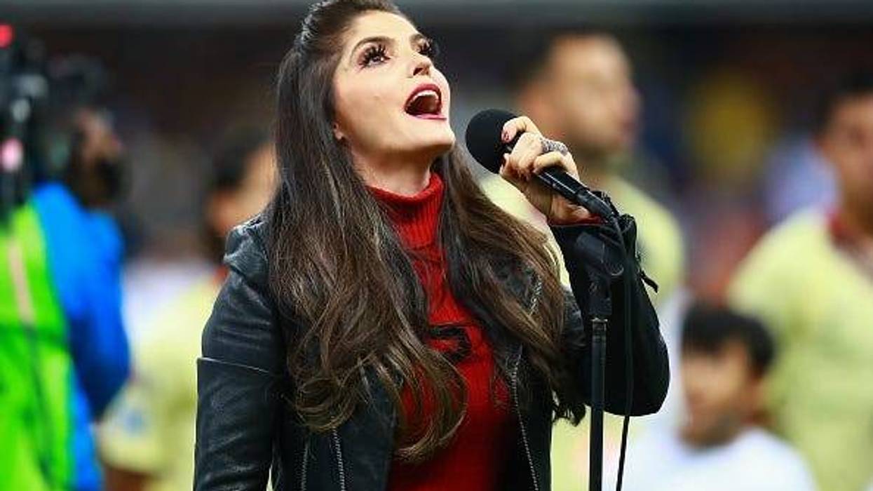 Singer Ana Barbara sings the national anthem of Mexico during the final first leg match between America and Cruz Azul as part of the Torneo Apertura 2018 Liga MX at Azteca Stadium on December 13, 2018 in Mexico City, Mexico.