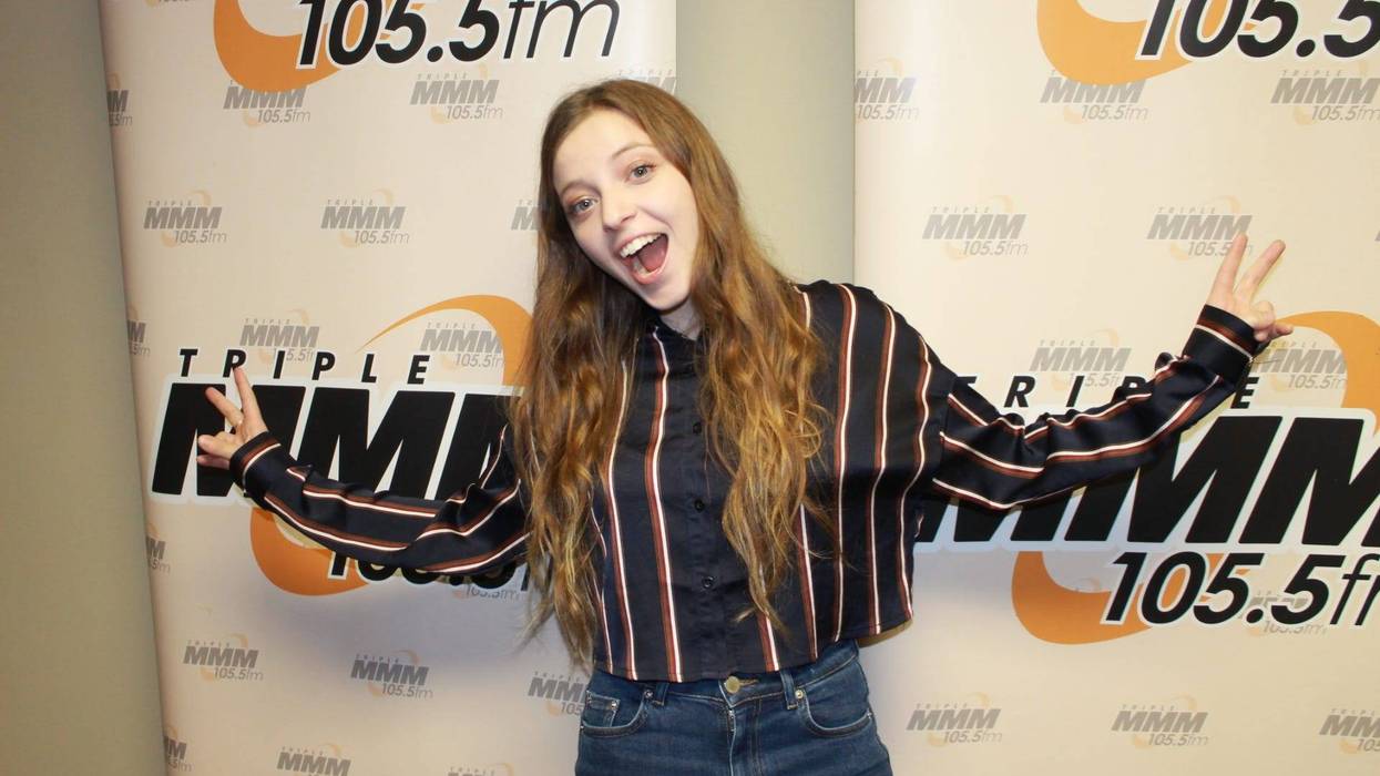Singer Songwriter Jade Bird in front of Triple M banner