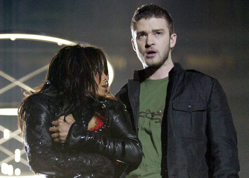 Singers Janet Jackson and surprise guest Justin Timberlake perform during the halftime show at Super Bowl XXXVIII between the New England Patriots and the Carolina Panthers at Reliant Stadium on February 1, 2004 in Houston, Texas. At the end of the performance, Timberlake tore away a piece of Jackson