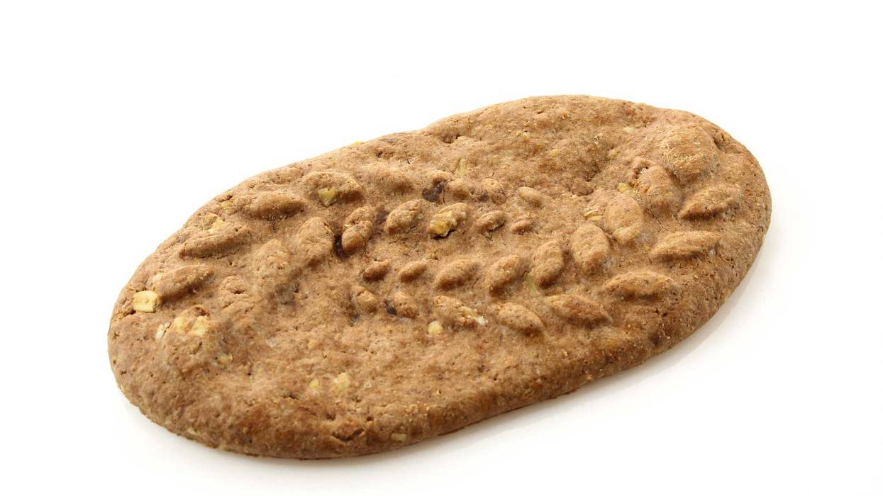 Single belVita brown diet cookie isolated on white background