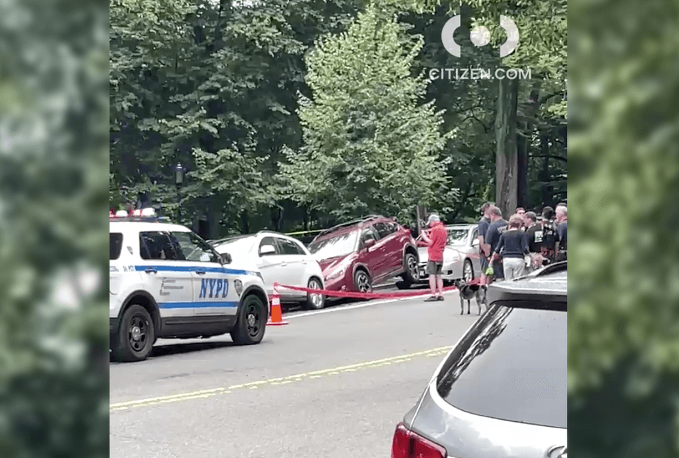 PHOTOS: 2 cars fall into sinkhole on New York City street