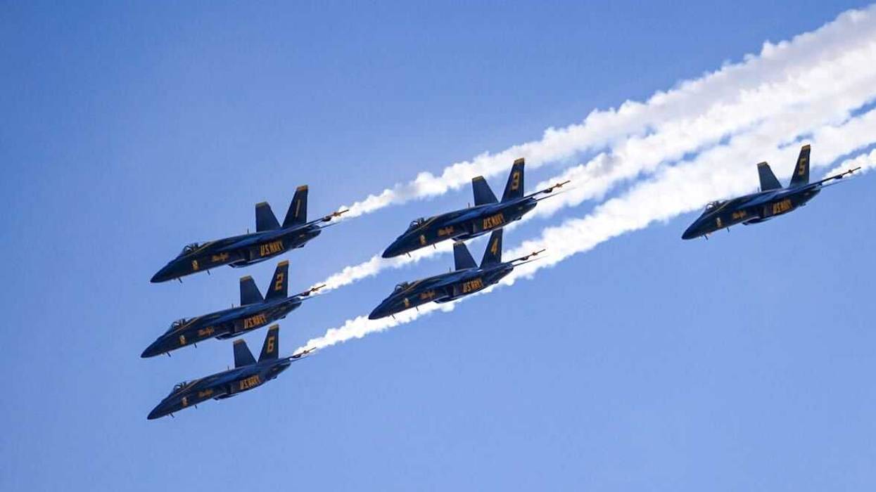 Six U.S. Navy Blue Angels fly in a triangle formation