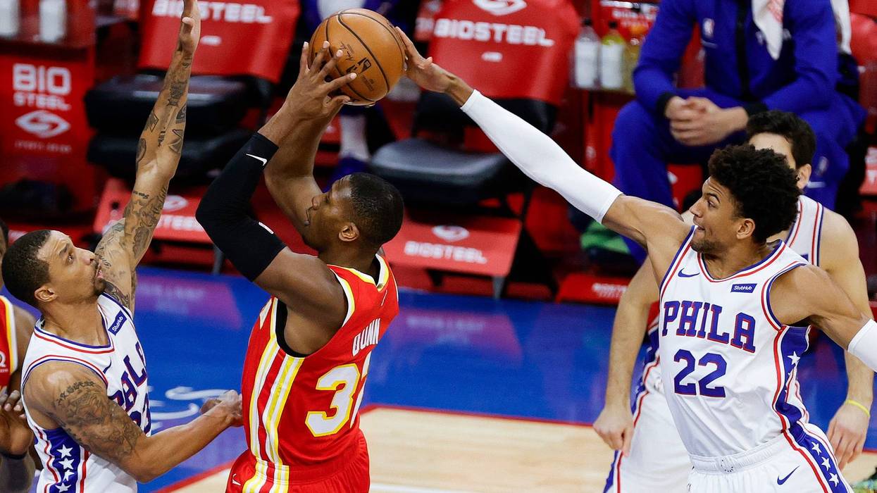 Sixers guard Matisse Thybulle blocks a shot from Hawks point guard Kris Dunn during the third quarter at the Wells Fargo Center on April 28, 2021.