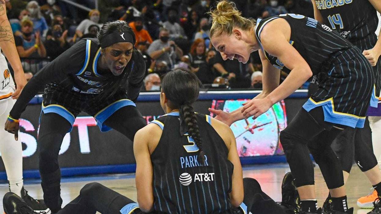Sky guard/forward Kahleah Copper (2) and guard Courtney Vandersloot (22) yell at Candace Parker (3) in celebration during their eventual win against the Mercury in Game 4 of the WNBA Finals on Sunday. The win gave the Sky their their first championship.