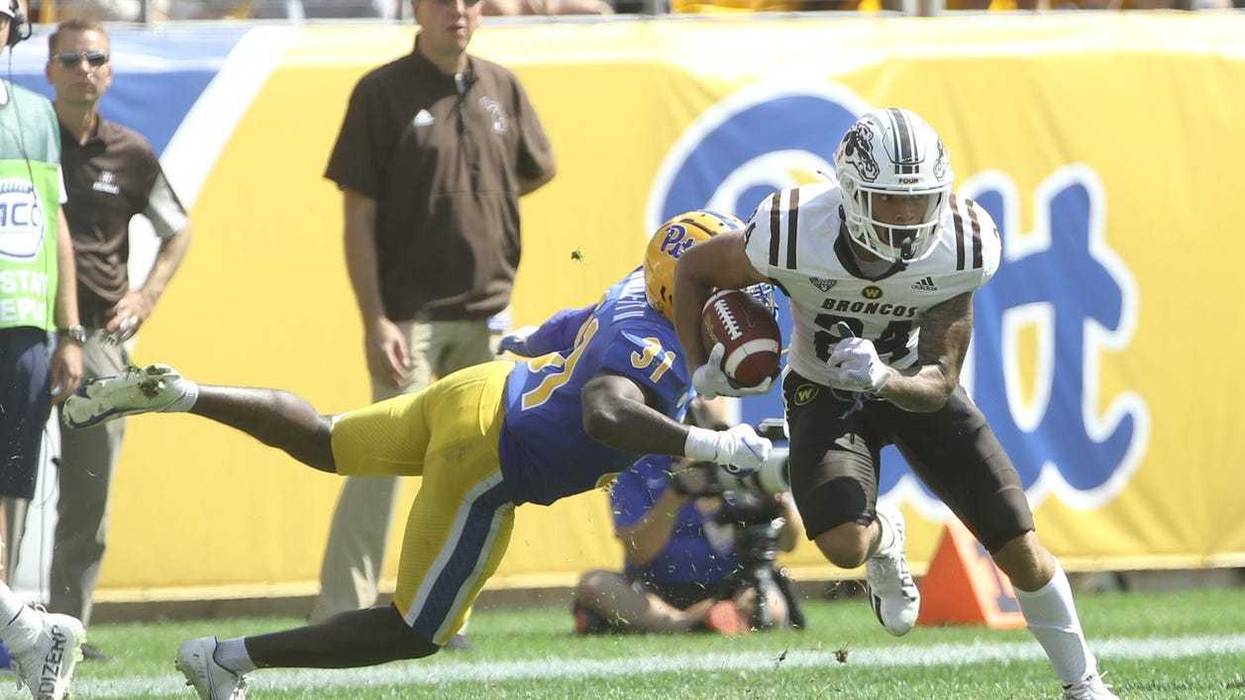 Skyy Moore eluding a Pitt tackler