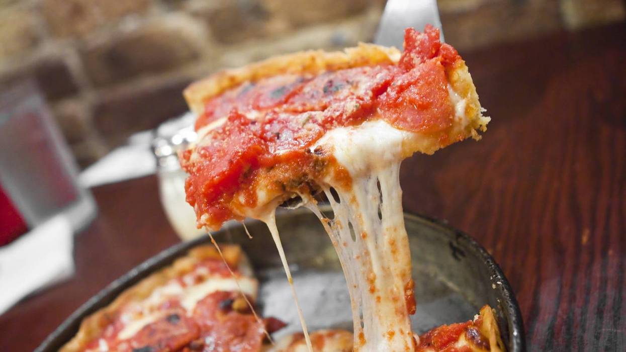 Slice of deep dish pizza.
