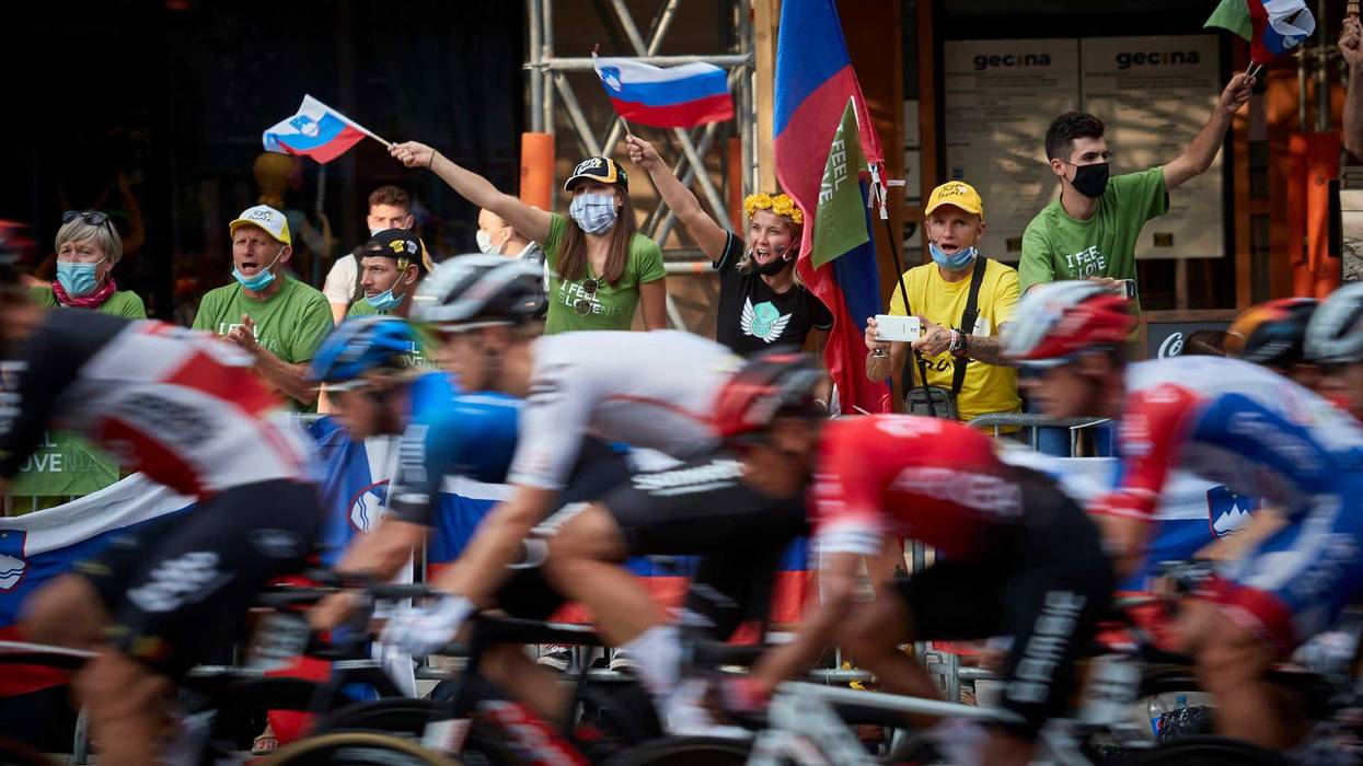 Slovenian cycling fans watch the final stage of the Tour de France on the Champs Elysees and cheer on their compatriot Tadej Pogacar as he wins this year's Tour on September 20, 2020 in Paris, France.