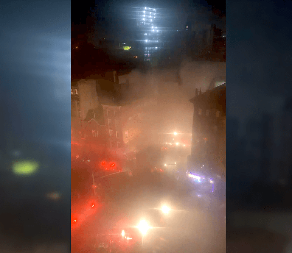 Smoke covered the intersection of Madison and Catherine streets early Tuesday as firefighters battled the fire