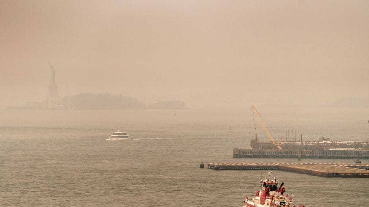 Smoke from wildfires in Canada shrouds the Statue of Liberty on June 30, 2023 in New York City. The eastern U.S. is once again experiencing air quality concerns as smoke from Canadian wildfires billows south with New York City's air quality index reaching 162 in many places. (Photo by David Dee Delgado/Getty Images)