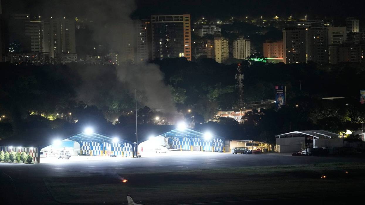 Smoke raises at La Carlota airport after explosions and low-flying aircraft were heard in Caracas, Venezuela, Saturday, Jan. 3, 2026.