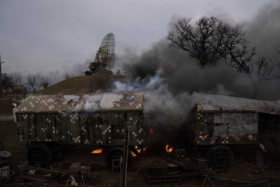 Smoke rise from an air defence base in the aftermath of an apparent Russian strike in Mariupol, Ukraine, Thursday, Feb. 24, 2022