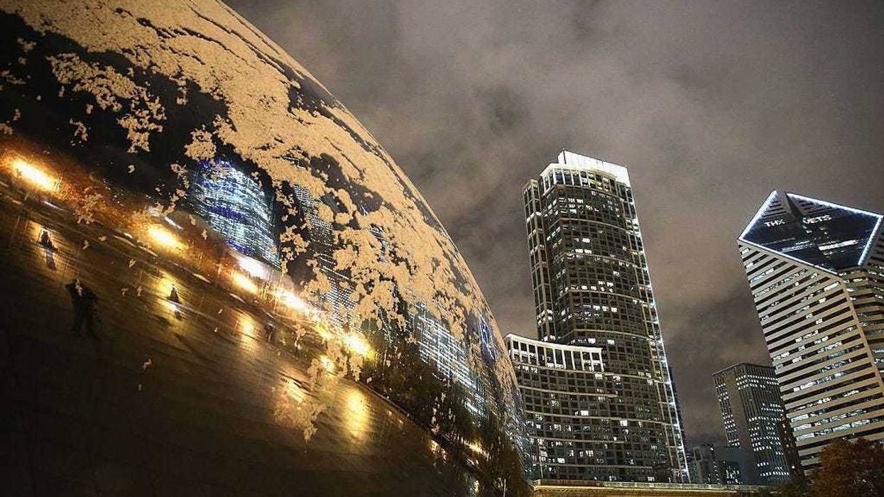 Snow collects on Anish Kapoor's Cloud Gate (also known as The Bean) in Milennium Park on November 11, 2013 in Chicago, Illinois. The snowfall was the first of the season for the city. (Photo by Scott Olson/Getty Images)