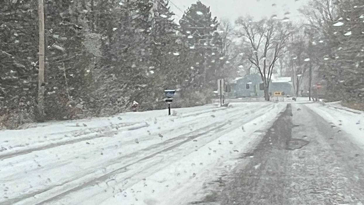 Snow covered secondary roads like this one across the Twin Cities early Monday morning. National Weather Service forecasters say the snow will continue most of the week, with heavier accumulations expected south of the Twin Cities.