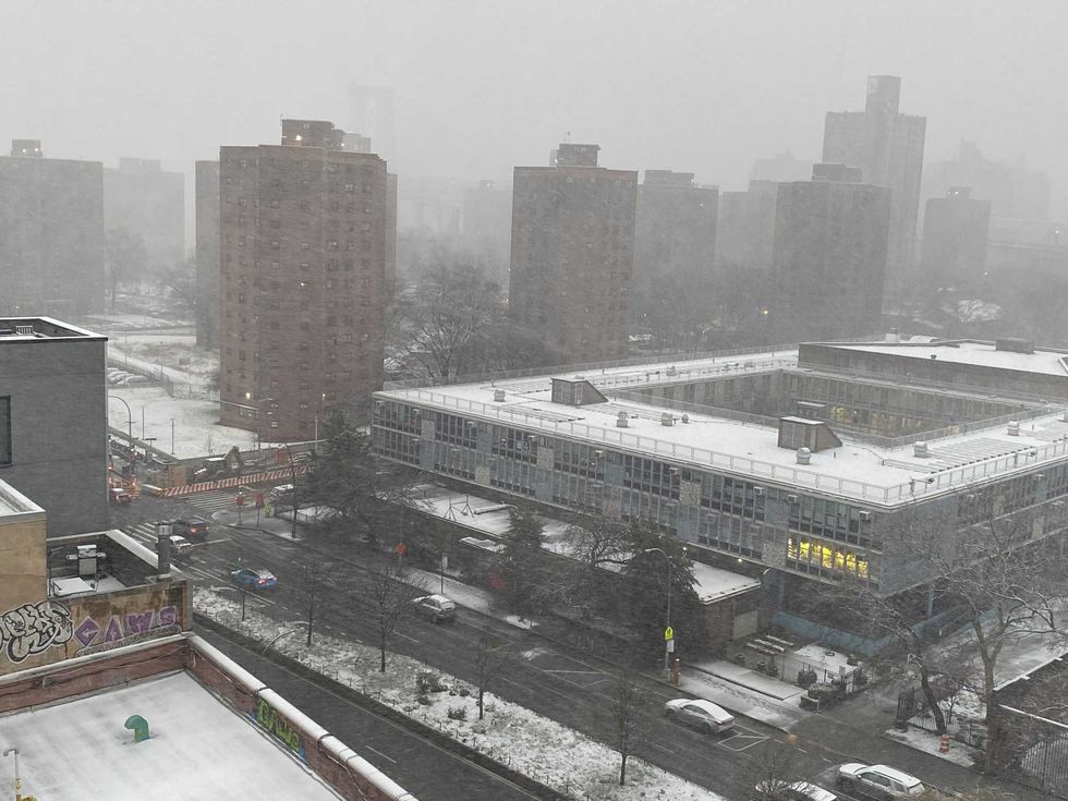 Snow falls on the East Village on Feb. 13, 2024