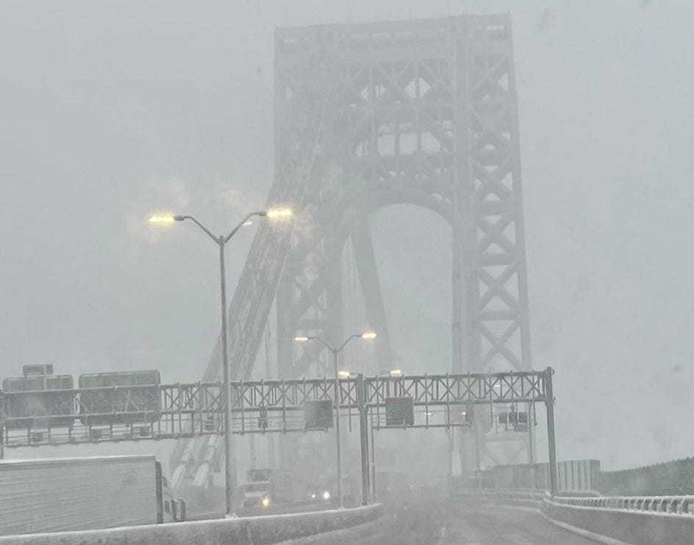 Snow falls on the George Washington Bridge on Feb. 13, 2024