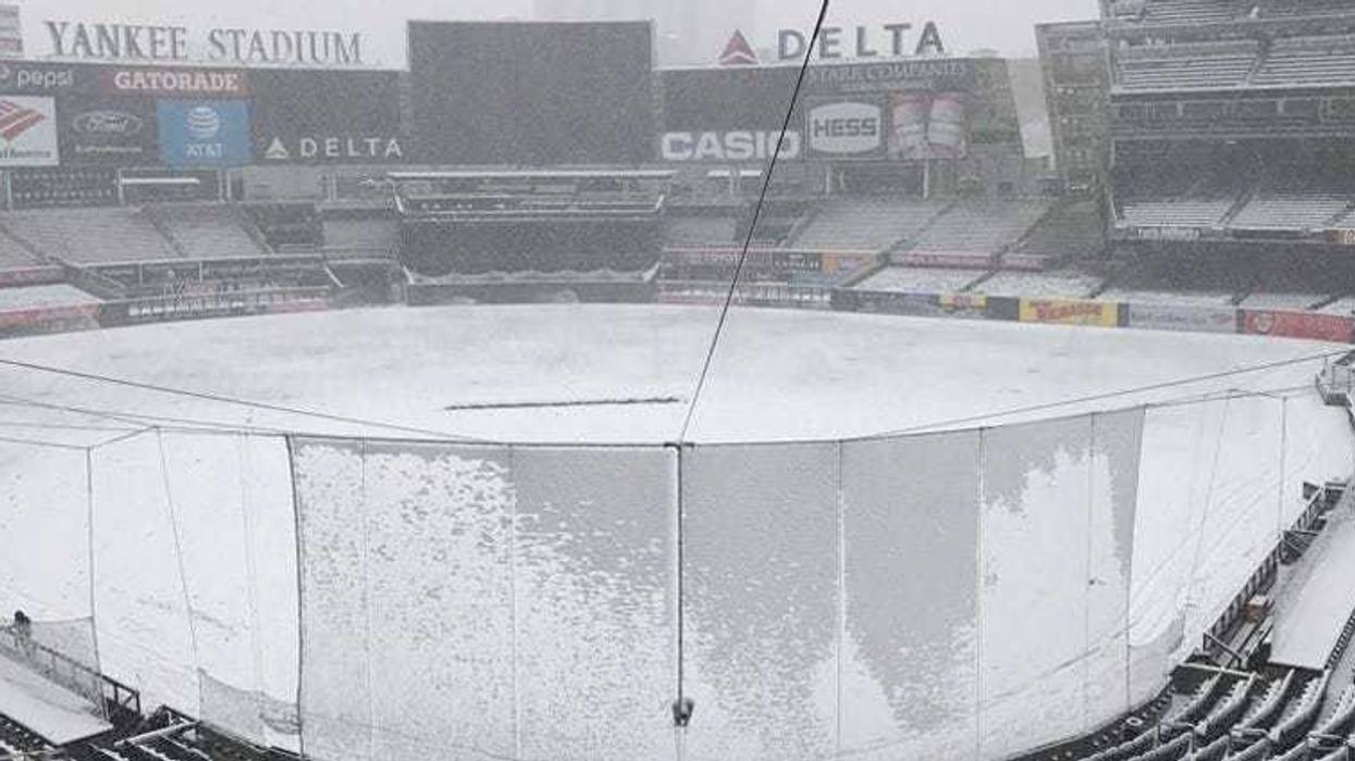 Snow is seen on the field of Yankee Stadium on April 2, 2018.