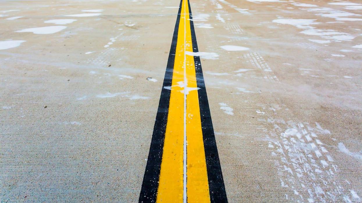 Snow on an airport runway - stock photo