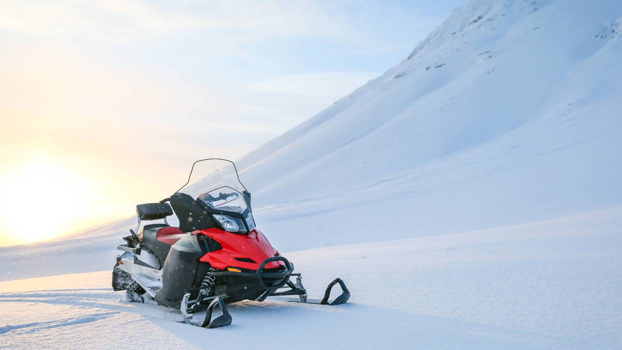 Snowmobile in the snowy mountains