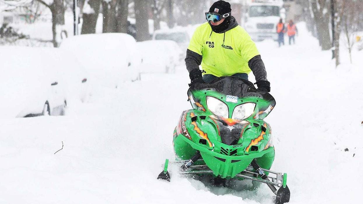 Snowmobile operator making his way to Home Depot so he could buy a shovel