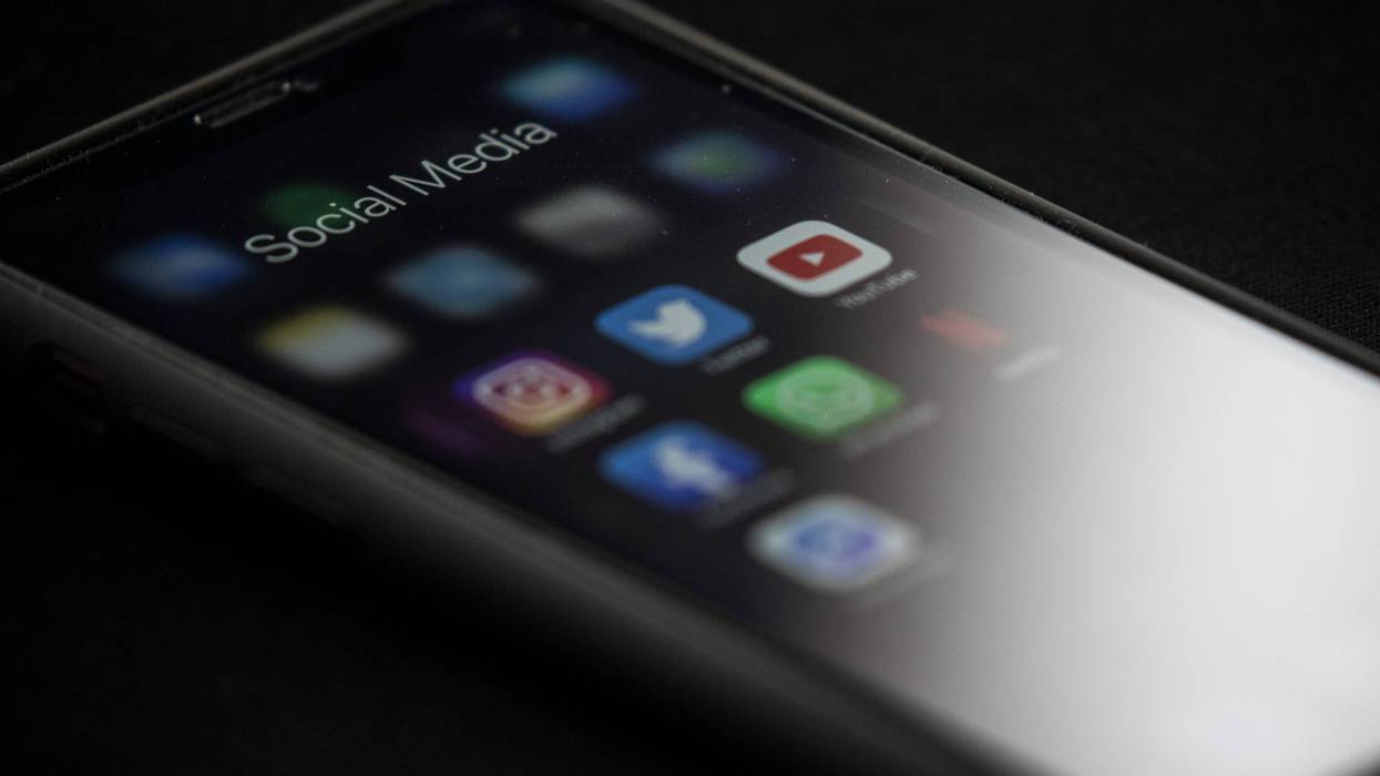 Social media apps, including Instagram and YouTube, are seen on a mobile phone.