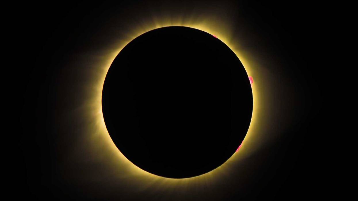 Solar Eclipse engulfed in a shadow cast by the Moon