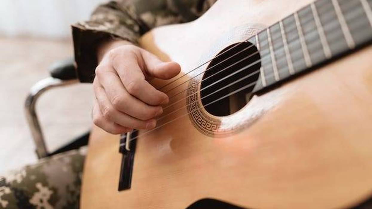 Soldier playing guitar