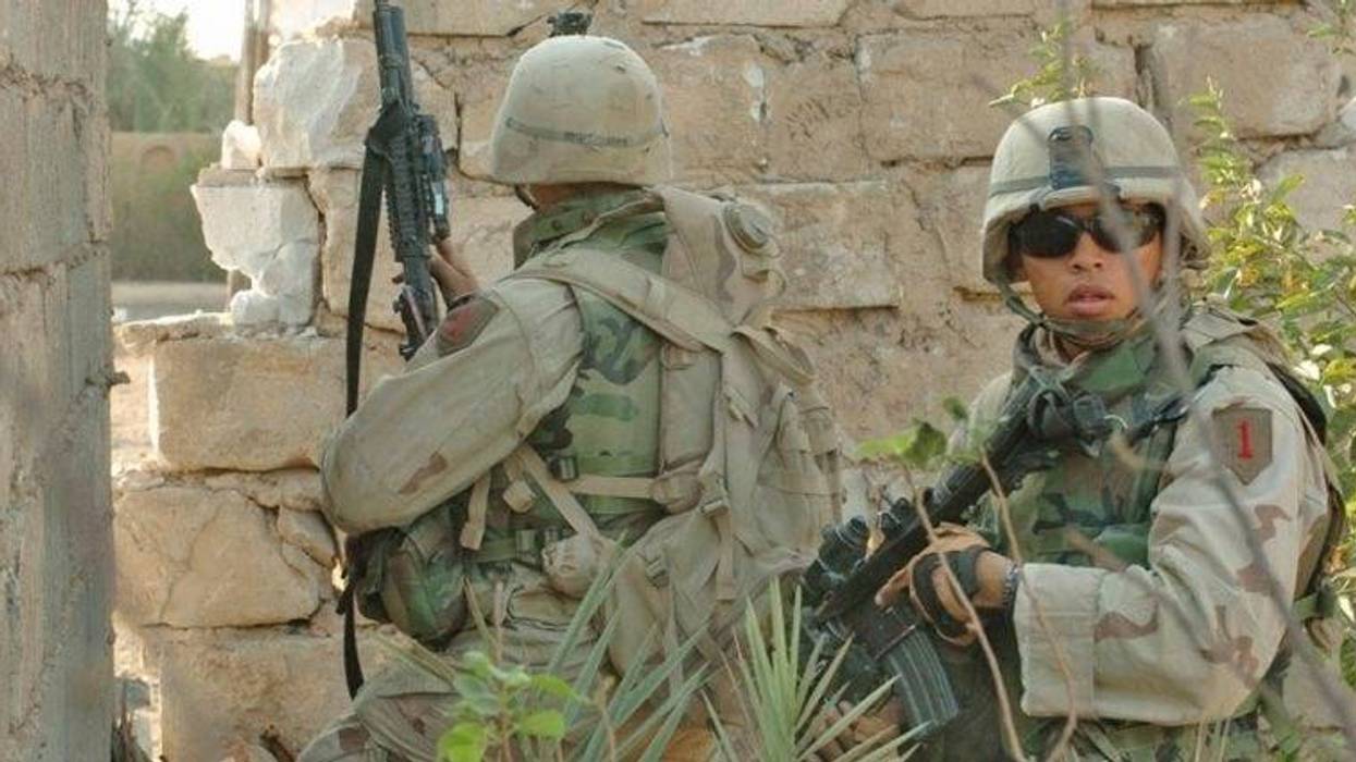 Soldiers from 1st Infantry Division, 3rd Brigade Reconnaissance Troop fight insurgents in Fallujah Iraq, Nov 2004