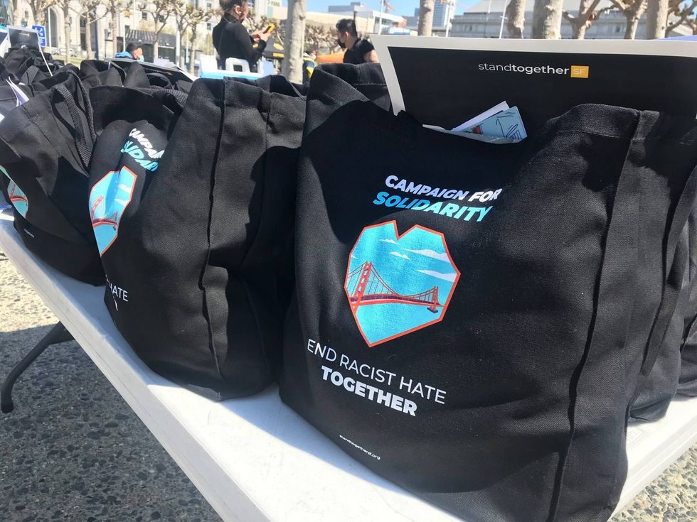 Solidarity kits sit on a folding table at the event.