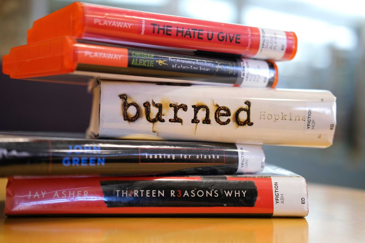 Some of the books some people want banned from pubic schools. Illustration photographed at Edmond Metropolitan Library. Tuesday, January 11, 2022. Book Ban 05