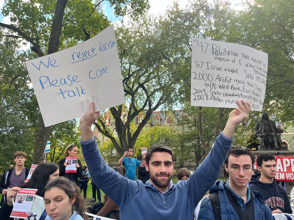Some pro-Israeli demonstrators hung back and listened to the pro-Palestinian demonstrators.