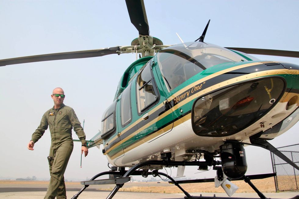 Sonoma County tactical flight officer Chris Haas with Henry 1.