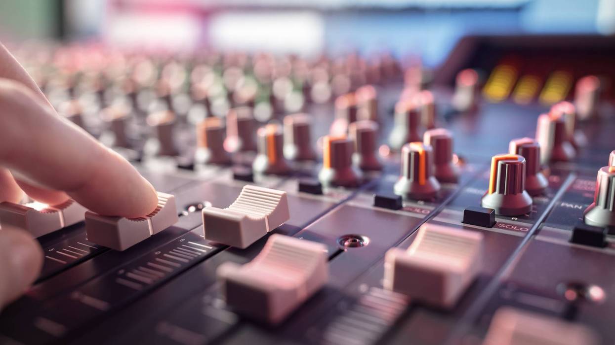 Sound recording studio mixing desk with engineer or music producer