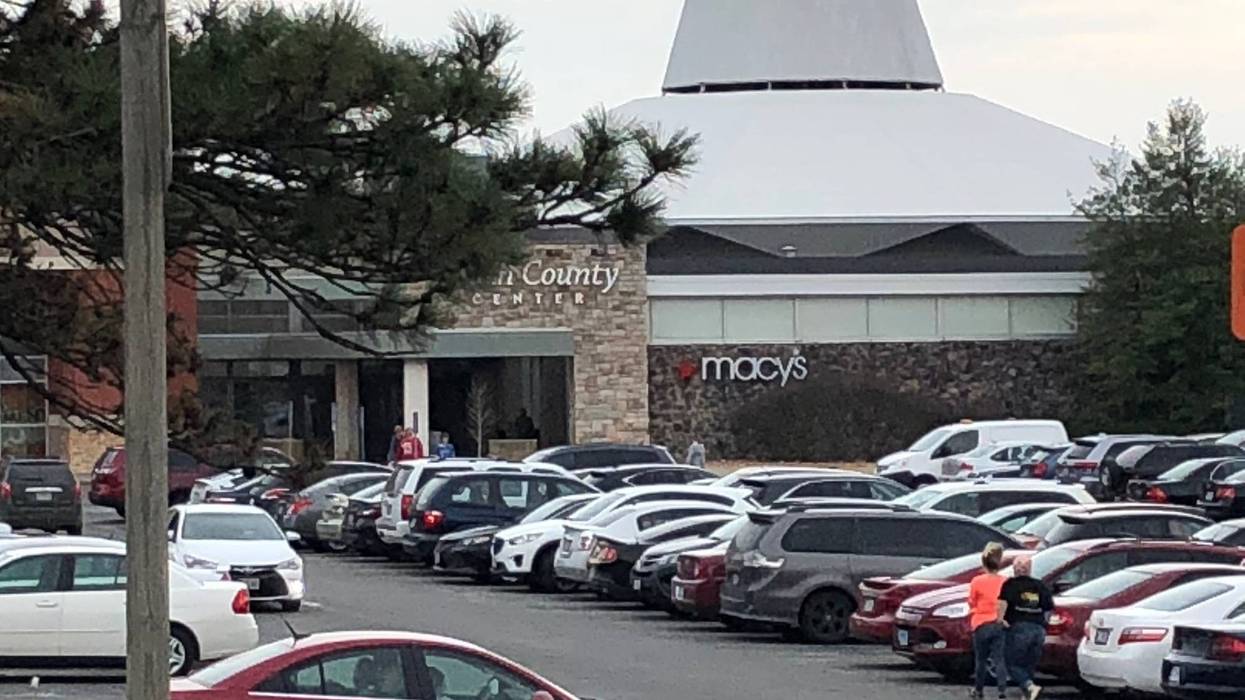 South County Center shopping mall parking lot people walking into entrance of Macys store