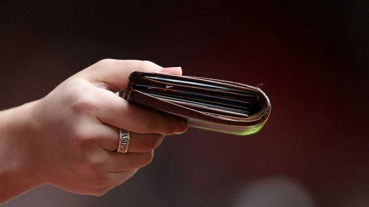 Southampton fans taunt Portsmouth players with their wallets during the FA Cup sponsored by E.ON fifth round match between Southampton and Portsmouth at St Mary's Stadium on February 13, 2010 in Southampton, England.