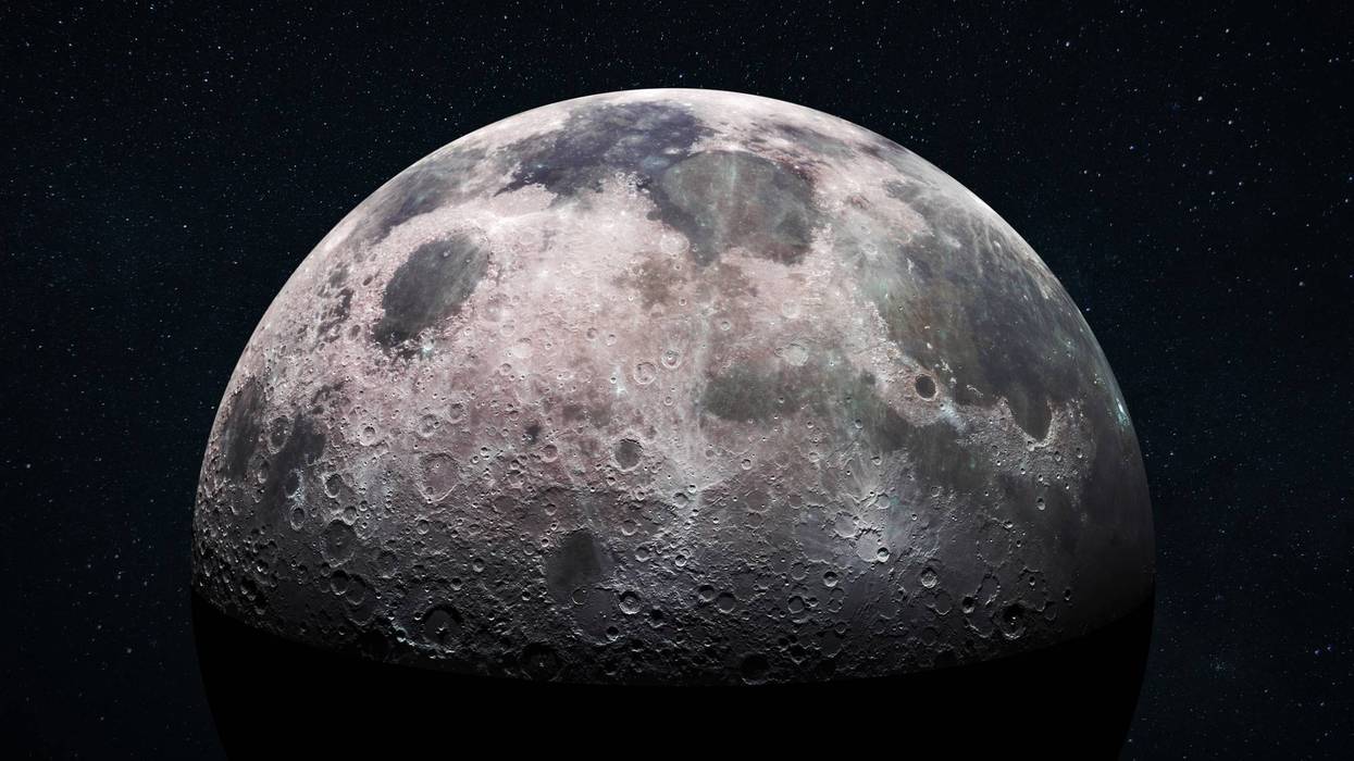 Space view of the moon's cratered surface with a star-filled outer space background. Deep space exploration and astronomy concept. Moon with detailed craters and surface