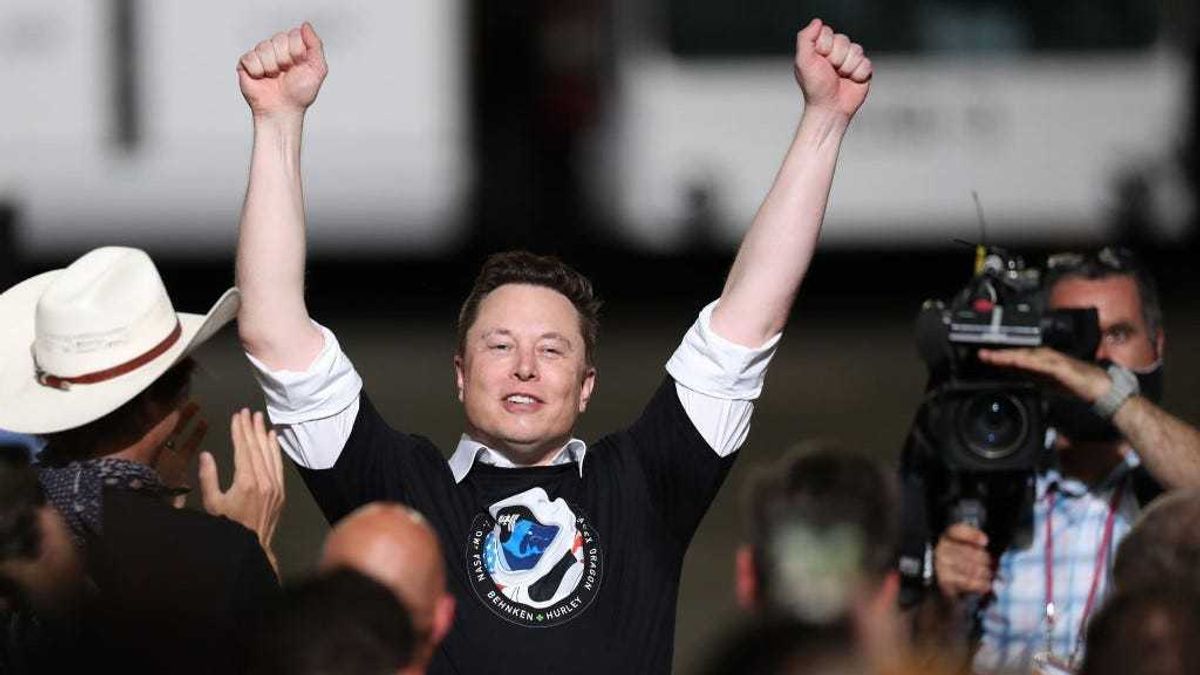 Spacex founder Elon Musk celebrates after the successful launch of the SpaceX Falcon 9 rocket with the manned Crew Dragon spacecraft at the Kennedy Space Center on May 30, 2020 in Cape Canaveral, Florida.