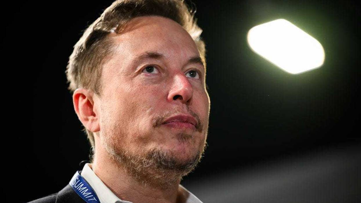 SpaceX, X (formerly known as Twitter), and Tesla CEO Elon Musk speaks with members of the media during day one of the AI Safety Summit at Bletchley Park on November 01, 2023 in Bletchley, England.