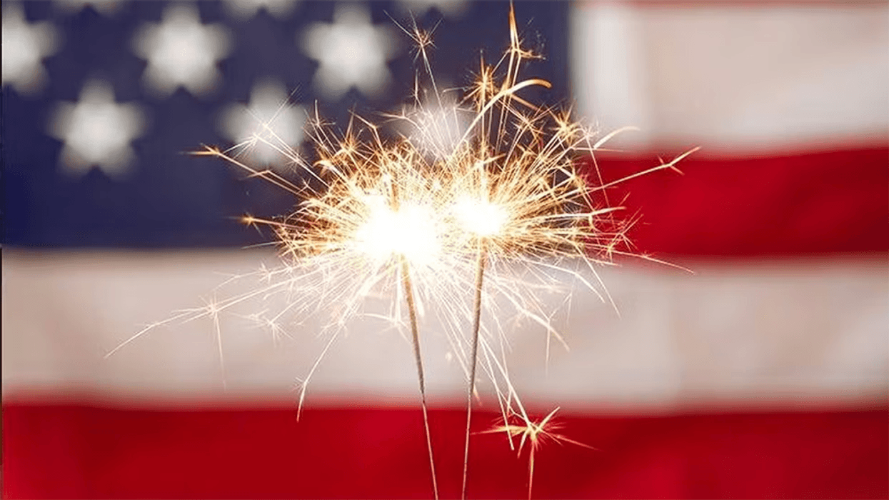 sparkler with American flag background