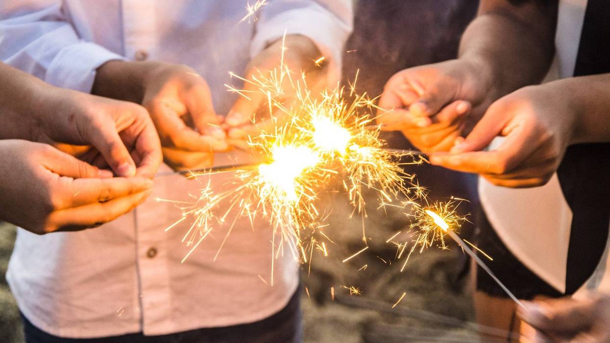 sparklers in people hands