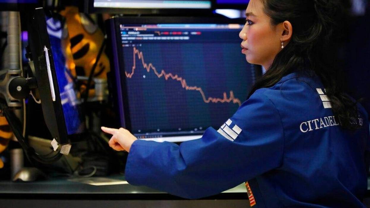 Specialist Lingbo Jiang works on the floor of the New York Stock Exchange