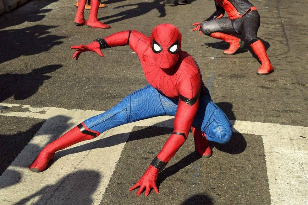 Spider-man performers are seen at the premiere of Sony Pictures