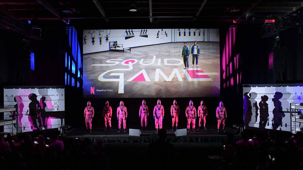 Squid Game guards appear onstage during Netflix's FYSEE event for "Squid Game" at Raleigh Studios Hollywood on June 12, 2022 in Los Angeles, California.