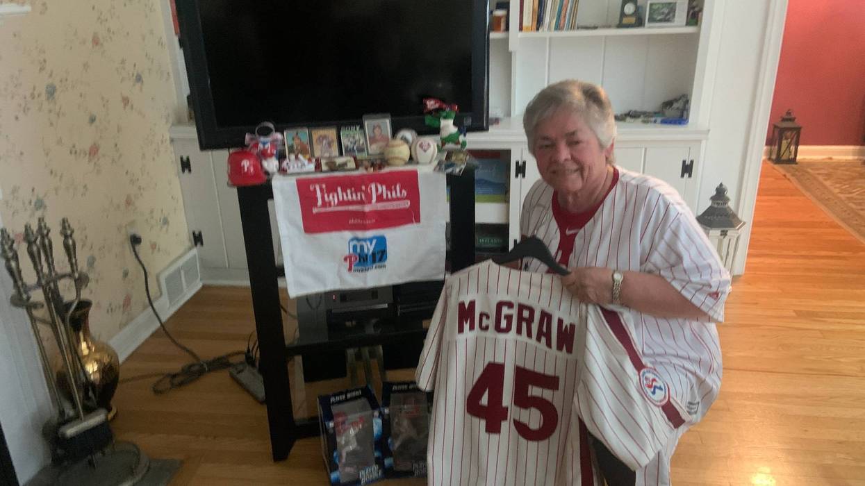 Sr. Linda DeCero by her "shrine" with many Philadelphia Phillies items alongside her religious relics.