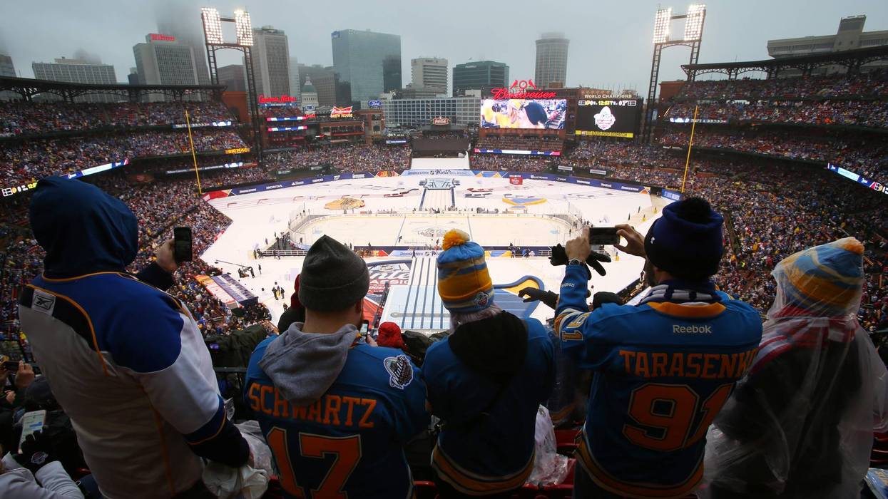St. Louis Blues fans take photos before the Winter Classic.