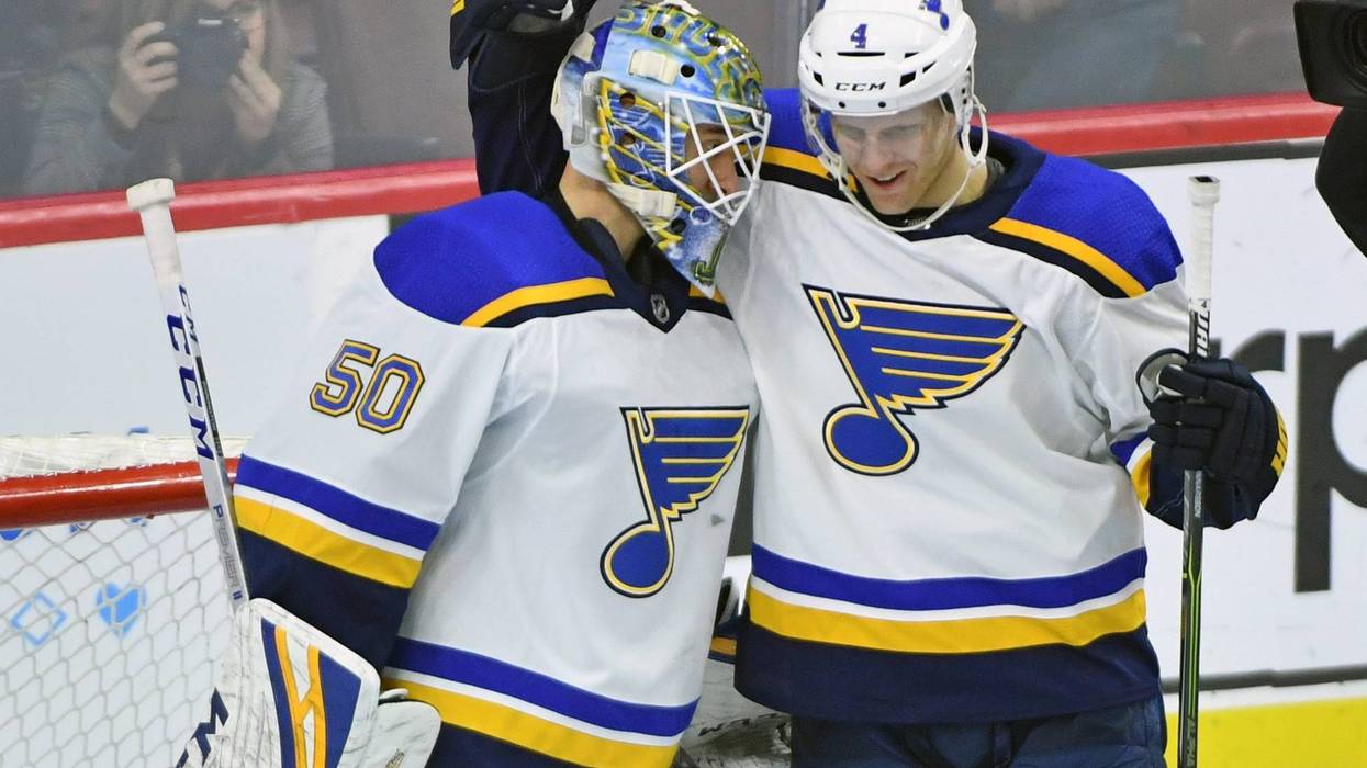 St. Louis Blues goaltender Jordan Binnington (50) celebrates with defenseman Carl Gunnarsson